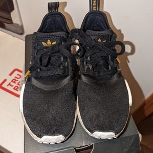 Black and gold Adidas nmd